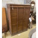 A mid century French oak triple tambour filing cabinet, width 118cm, depth 71cm, height 172cm