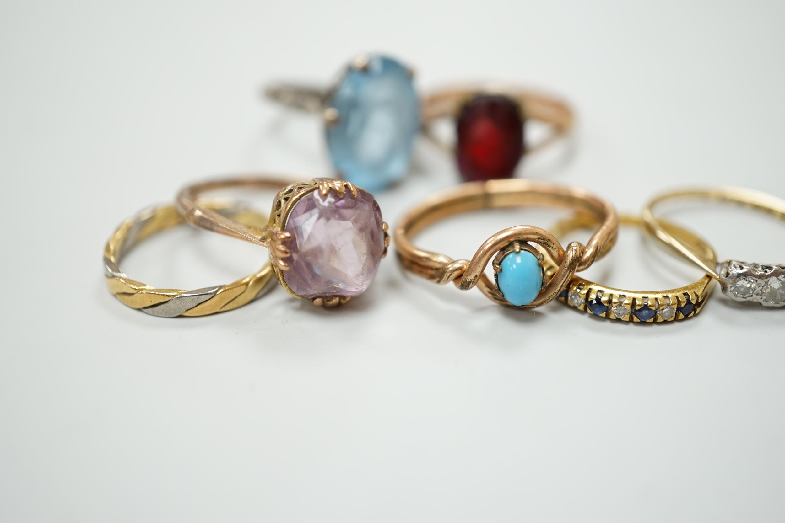 Seven assorted dress rings, comprising an 18ct gold three stone diamond ring, size M, a 9ct gold - Image 2 of 3