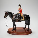 A Beswick ‘trooping the colour’ limited edition figure of Her Majesty The Queen on Burmese, on