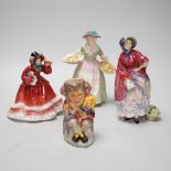 Three Royal Doulton figurines including Christmas Time HN2110 and a Toby jug, The Jester, the