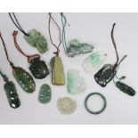 Thirteen Chinese jadeite and jade carvings, longest 6.4cm