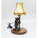 A Black Forest 'bear' table lamp, 36cm including shade