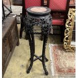 A Chinese carved hardwood circular rouge marble topped vase stand, height 91cm