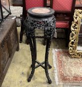 A Chinese carved hardwood circular rouge marble topped vase stand, height 91cm