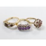 Three 9ct gold dress rings: white opal and ruby, size L, diamond and amethyst, size L and ruby and