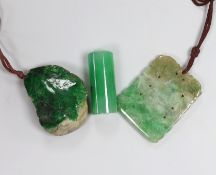 Two jadeite pendants and a handle tip