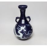 A Chinese blue ground dragon chasing the flaming pearl hu vase, 35cm high