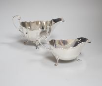 An Edwardian crested silver sauceboat, of lobed form, with scroll feet, makers R & B, Sheffield