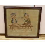 A Victorian woolwork panel depicting children playing cards, framed, 62 x 56cm