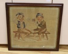 A Victorian woolwork panel depicting children playing cards, framed, 62 x 56cm