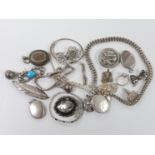 A group of assorted silver and white metal costume jewellery