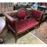 A Victorian style carved mahogany settee, length 156cm, depth 61cm, height 96cm