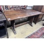 A 1920's rectangular oak dining table, length 145cm, depth 74cm, height 76cm