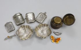 Three engraved silver vesta cases, a base metal vesta case, a pair of late Victorian silver
