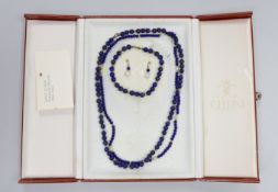 An 18k gold mounted lapis lazuli and cultured pearl suite of jewellery comprising two necklaces, a