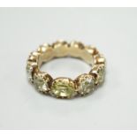 A 19th century green paste and yellow metal eternity ring, size L