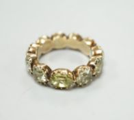 A 19th century green paste and yellow metal eternity ring, size L