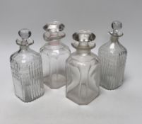 Two pairs of Georgian moulded and cut glass square decanters, all with lips, stoppers and ground