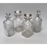 Two pairs of Georgian moulded and cut glass square decanters, all with lips, stoppers and ground