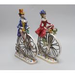 A pair of 1950’s- 60’s Italian ceramic penny farthing cyclists, 31cm