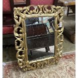 A rectangular Florentine style carved giltwood wall mirror, width 65cm, height 81cm