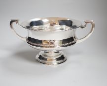 A George V two handled silver bowl, with pedestal foot and beaded rim, makers Elkington & Co.,