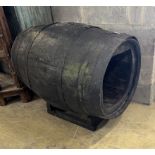 A vintage coopered wine barrel on stand, now converted to a dog's kennel, width 96cm, height 76cm