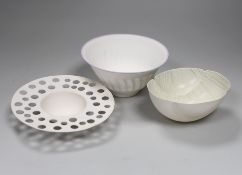 Three bone china studio bowls, one with pierced decoration, the largest 14.5cm in diameter