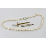 An early 20th century diamond set gold bar brooch, a cultured pearl necklace and a sword shaped