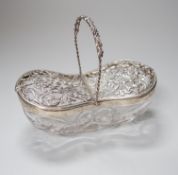 A George V silver mounted Stoubridge glass bon bon basket, with swing handle and two foliate