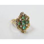 A yellow metal emerald and diamond ring of antique design, size L