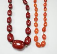 A simulated graduated red amber bead necklace, 52cm and an orange agate bead necklace, 92cm