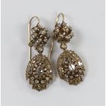 A pair of antique diamond set yellow metal drop earrings, probably Indian, 4.5cm