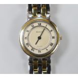 A lady's gold and steel Gucci quartz wrist watch