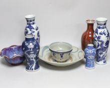 A group of Chinese blue and white ceramics including two prunus flower vases and three bowls and a