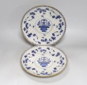 A pair of floral Delft blue and white plates, each 26cm in diameter