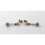 A pair of early 20th century diamond two stone drop earrings, 2cm