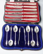 A cased set of six late Victorian silver apostle teaspoons and tongs, Sheffield 1900, 116 grams, and