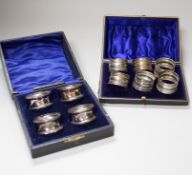 A cased set of six Edwardian silver napkin rings, Birmingham 1910, 71 grams and a cased set of
