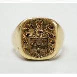 An 18ct gold signet ring carved with a coat of arms, size M, 14.2 grams