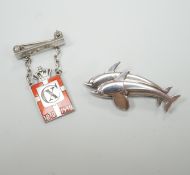 A Georg Jensen 925 standard white metal twin dolphin brooch, no.317, 4cm and an Jensen Kingmark