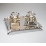 An Edwardian silver double inkstand, with two square glass wells, makers JTH over JHN, London