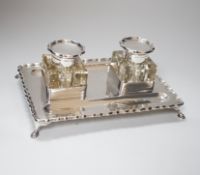 An Edwardian silver double inkstand, with two square glass wells, makers JTH over JHN, London