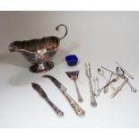 A group of assorted silver including a George V silver sauceboat, with flying scroll handle,