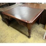 A late Victorian mahogany and cedar kneehole writing table, width 137cm, depth 107cm, height 75cm