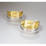 A pair of George III oval tub shaped two handled silver salts, with gilt interiors, maker TR,
