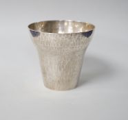 A George V planished silver tumbler cup, makers initial ACP (Alfred Charles Pruden), London 1931,