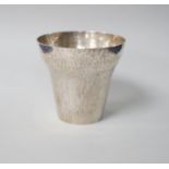 A George V planished silver tumbler cup, makers initial ACP (Alfred Charles Pruden), London 1931,