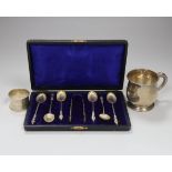 A cased set of six Edwardian silver apostle teaspoons and tongs, London 1903, 63 grams, a later