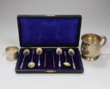 A cased set of six Edwardian silver apostle teaspoons and tongs, London 1903, 63 grams, a later